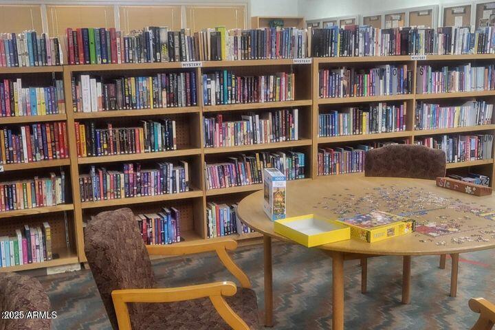 17200 West Bell Road, Unit 330 Surprise, AZ 85374 - Photo 33 of 39 a view of a workspace with bookshelf