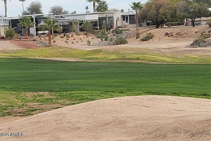 17200 West Bell Road, Unit 330 Surprise, AZ 85374 - Photo 35 of 39 a view of a swimming pool with a lounge chairs