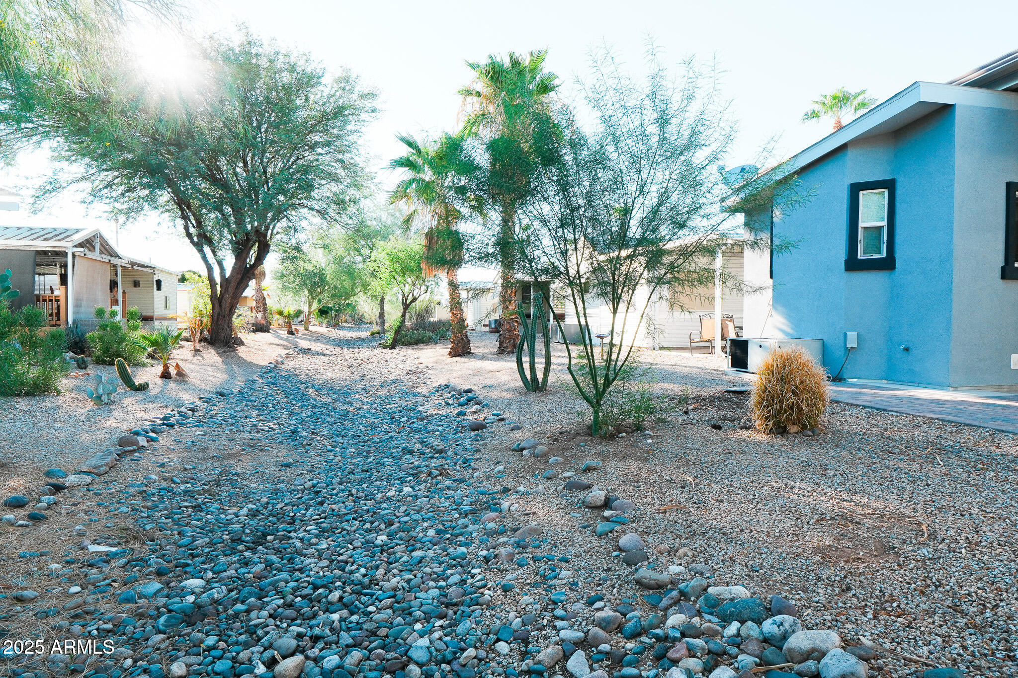 17200 West Bell Road, Unit 330 Surprise, AZ 85374 - Photo 9 of 39 a view of a backyard with large trees and plants
