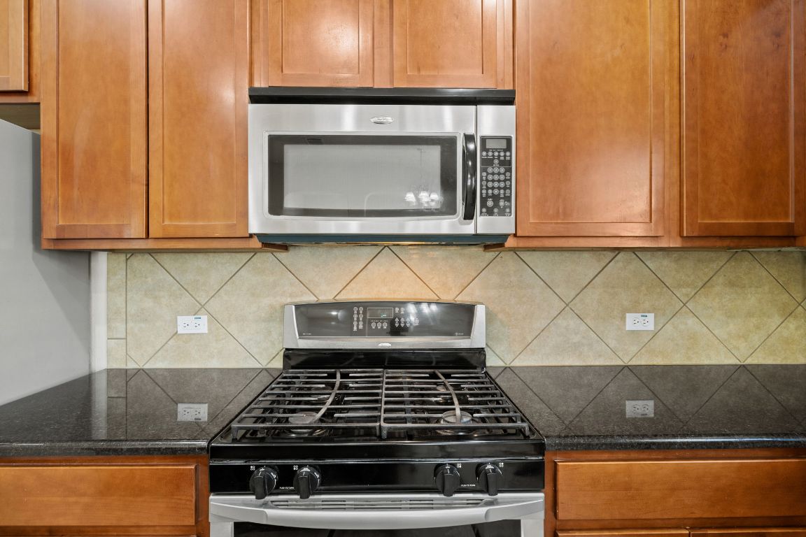 1900 Main Street Cedar Park, TX 78613 - Photo 13 of 34 a stove top oven sitting inside of a kitchen