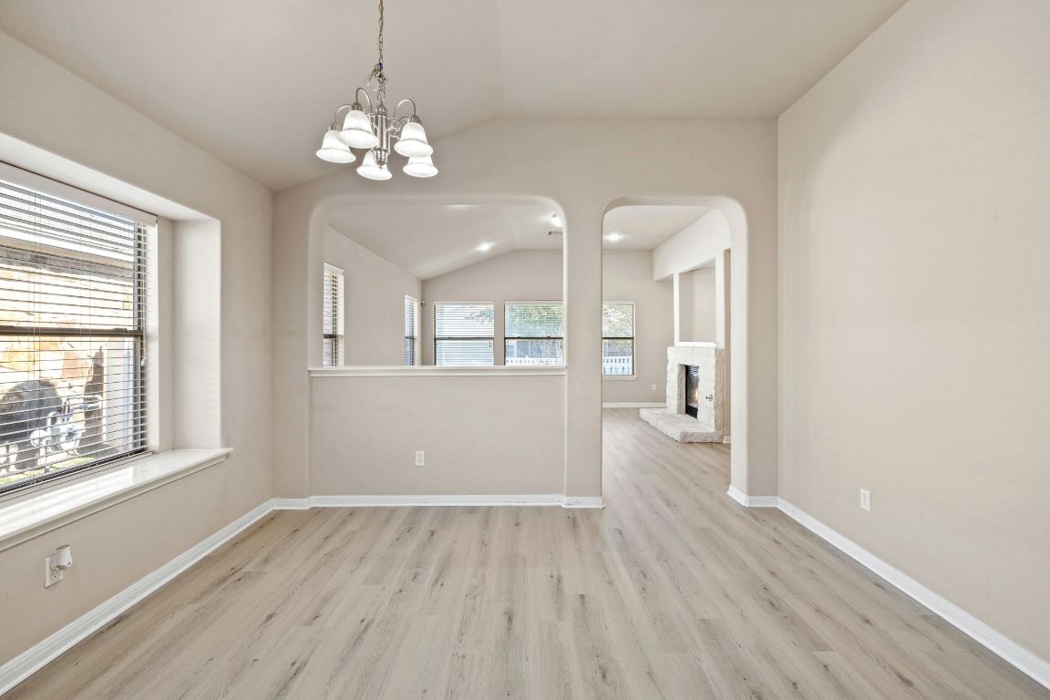 1900 Main Street Cedar Park, TX 78613 - Photo 15 of 34 a view of livingroom with chandelier and wooden floor