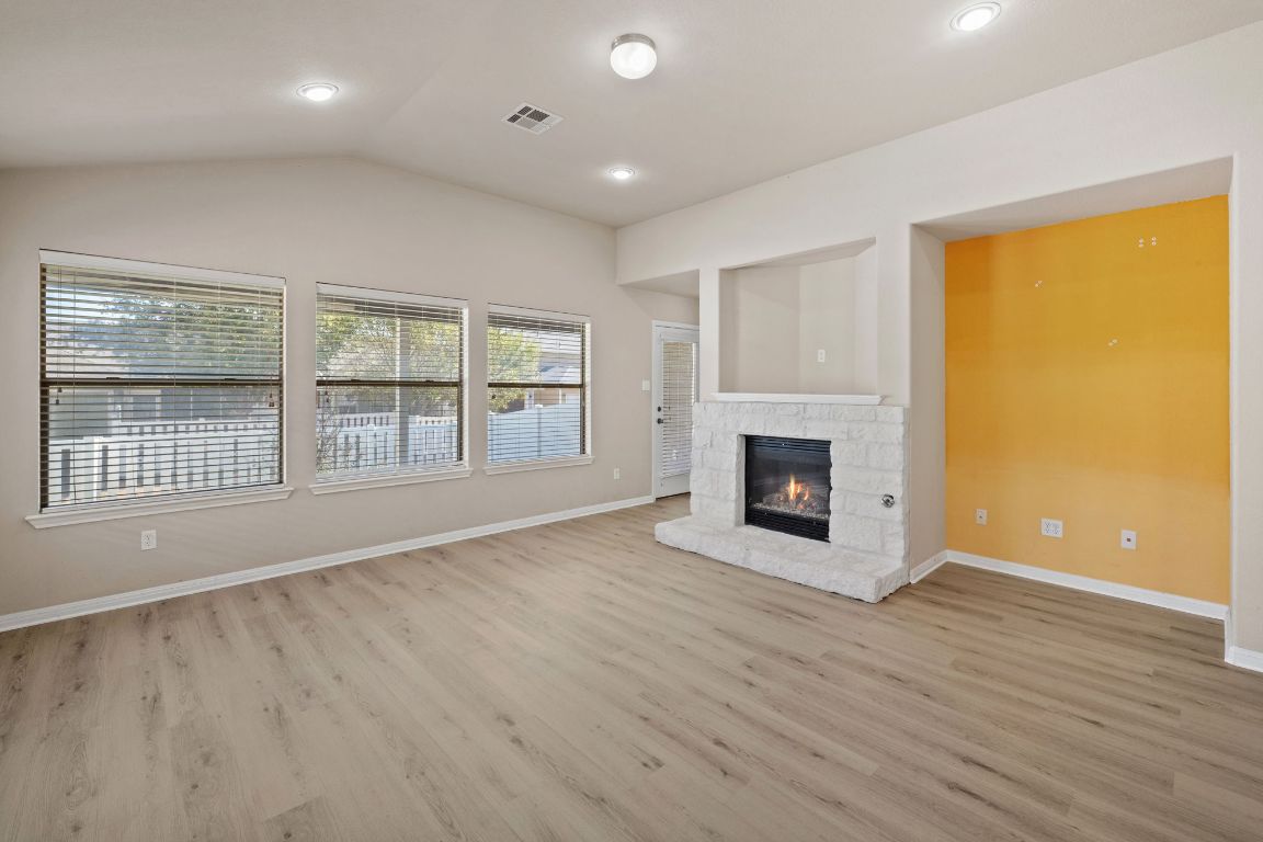 1900 Main Street Cedar Park, TX 78613 - Photo 16 of 34 an empty room with wooden floor and windows