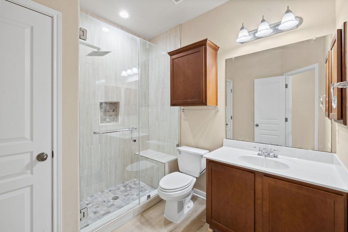1900 Main Street Cedar Park, TX 78613 - Photo 26 of 34 a bathroom with a bathtub shower sink mirror and toilet