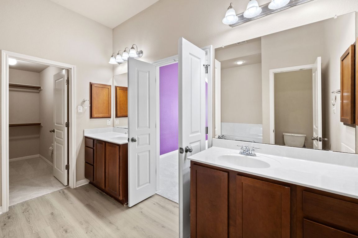 1900 Main Street Cedar Park, TX 78613 - Photo 31 of 34 a bathroom with a sink vanity tub and shower