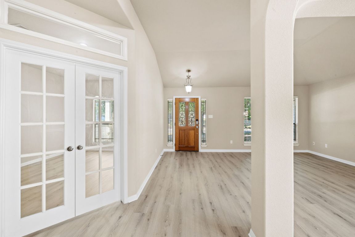 1900 Main Street Cedar Park, TX 78613 - Photo 4 of 34 an empty room with wooden floor and windows