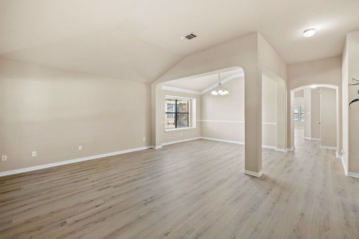 1900 Main Street Cedar Park, TX 78613 - Photo 5 of 34 wooden floor in an empty room with a window