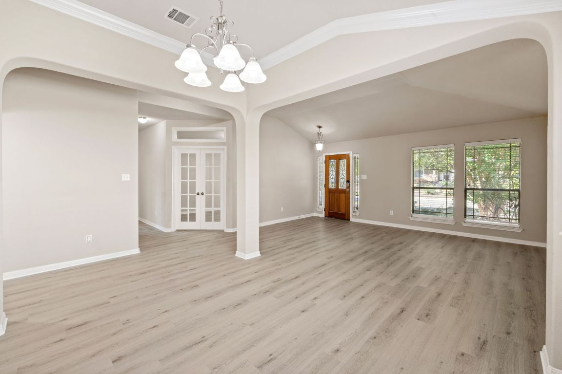 1900 Main Street Cedar Park, TX 78613 - Photo 8 of 34 a view of an empty room with wooden floor and a window