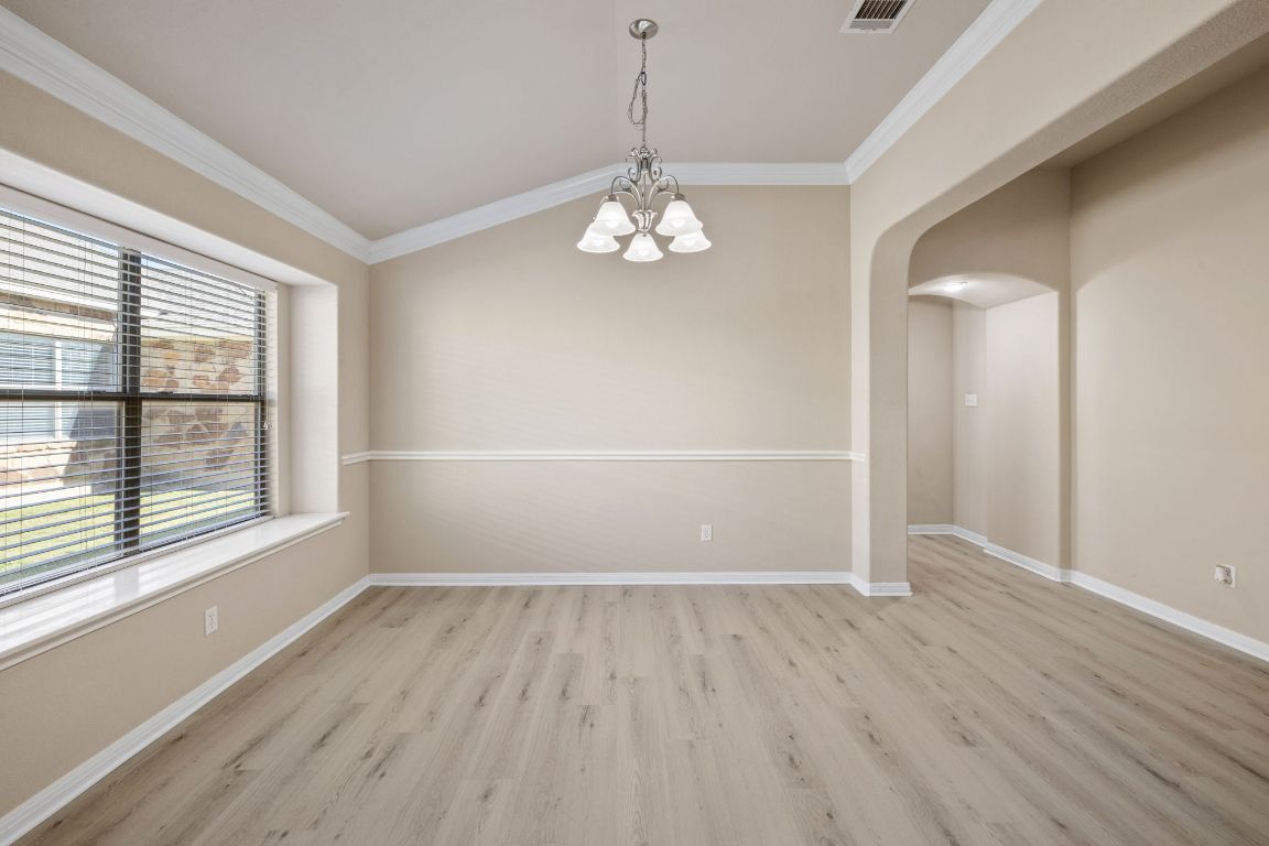 1900 Main Street Cedar Park, TX 78613 - Photo 9 of 34 wooden floor in an empty room with a window