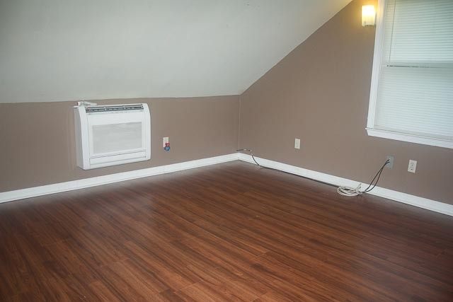3220 Les Chappell Road Spring Hill, TN 37174 - Photo 32 of 70 a view of an empty room with wooden floor and a window
