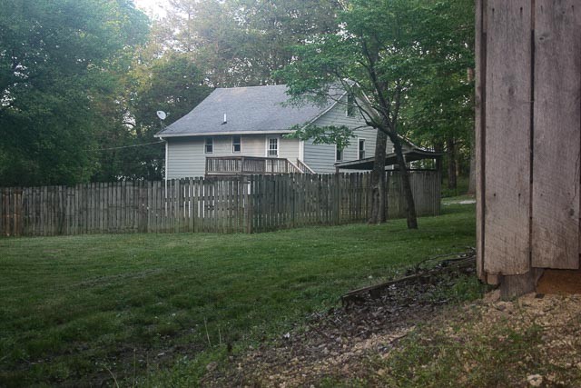 3220 Les Chappell Road Spring Hill, TN 37174 - Photo 57 of 70 a view of a yard in front of a house with large trees