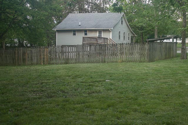 3220 Les Chappell Road Spring Hill, TN 37174 - Photo 59 of 70 a view of a small yard in front of a house with a large yard and large trees