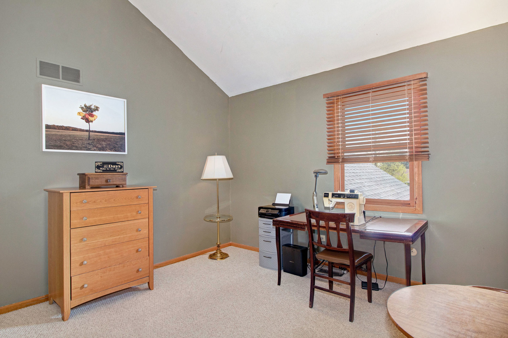 409 South Raven Road Shorewood, IL 60404 - Photo 14 of 22 a room with furniture and a window