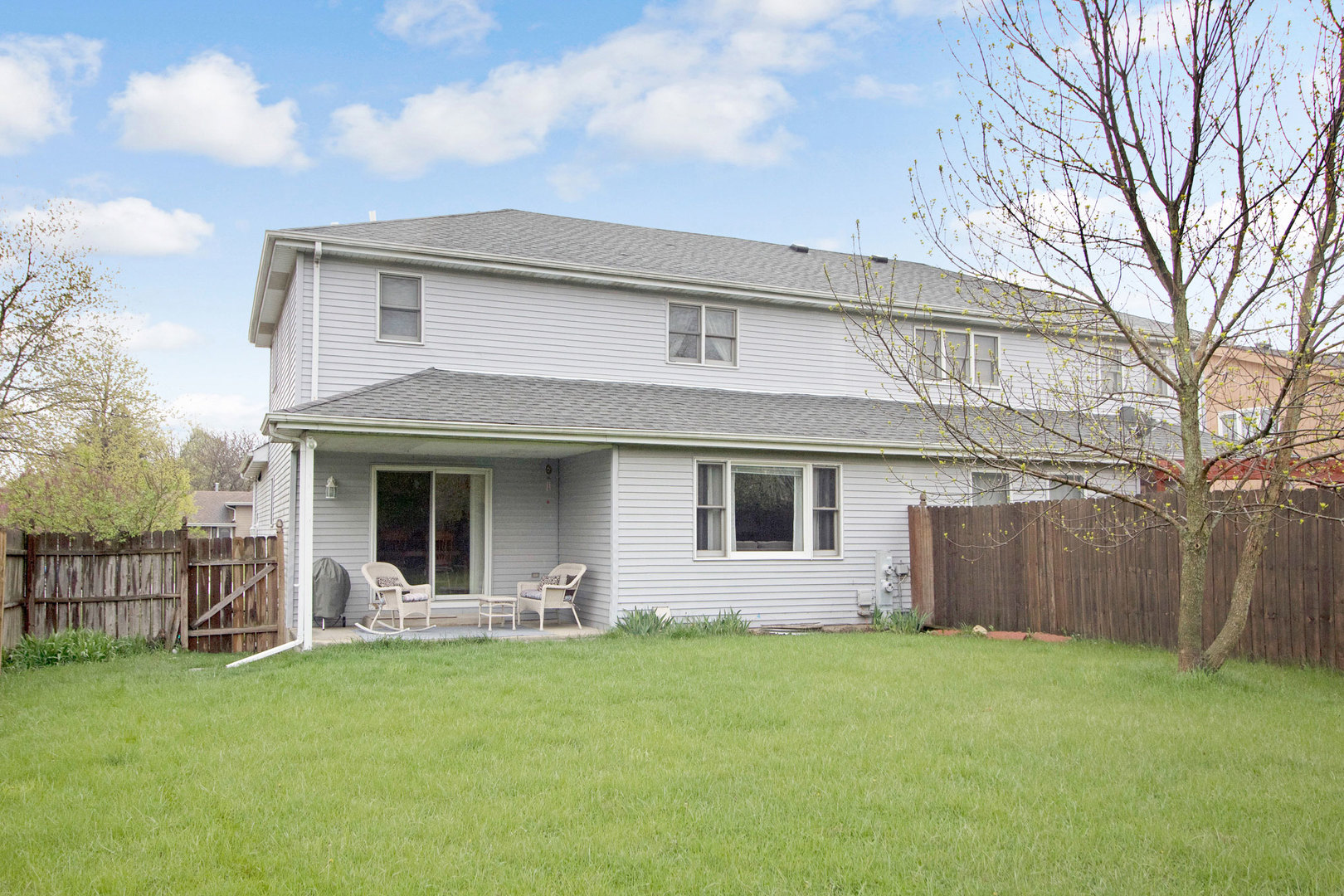 409 South Raven Road Shorewood, IL 60404 - Photo 22 of 22 a front view of house with yard and green space