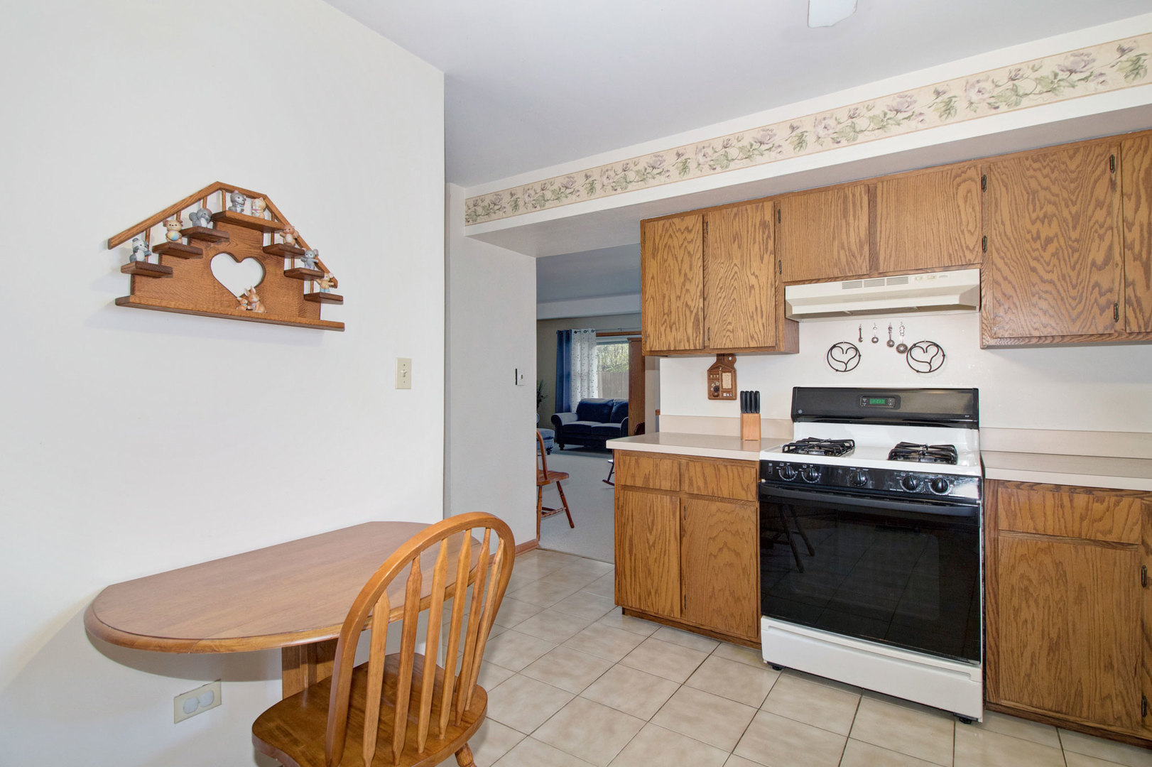 409 South Raven Road Shorewood, IL 60404 - Photo 8 of 22 a kitchen with stainless steel appliances granite countertop a stove a sink and a microwave