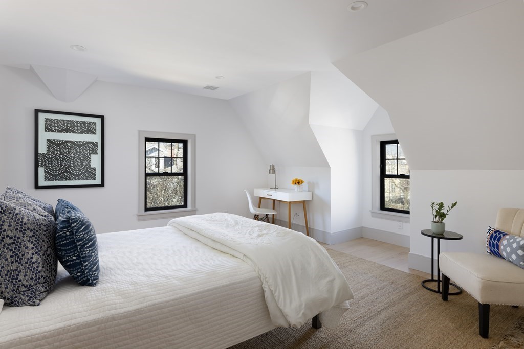 21 Naples Road, Unit 2 Brookline, MA 02446 - Photo 14 of 21 a spacious bedroom with a bed and wooden floor