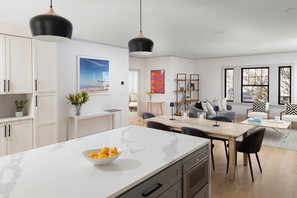 21 Naples Road, Unit 2 Brookline, MA 02446 - Photo 6 of 21 a living room with furniture and a chandelier