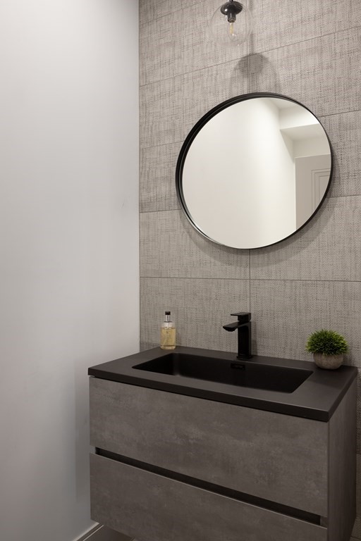 21 Naples Road, Unit 2 Brookline, MA 02446 - Photo 9 of 21 a bathroom with a sink and a mirror
