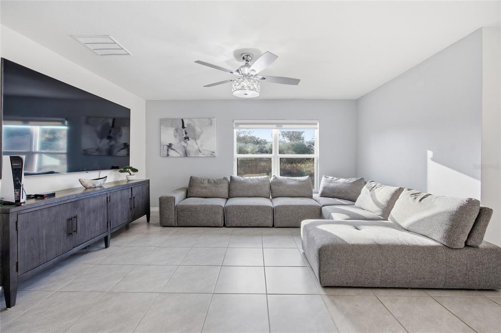 16402 Southwest 17th Terr Road Ocala, FL 34473 - Photo 20 of 36 a living room with furniture and a large window