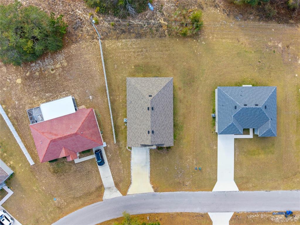 16402 Southwest 17th Terr Road Ocala, FL 34473 - Photo 31 of 36 an aerial view of residential houses with outdoor space