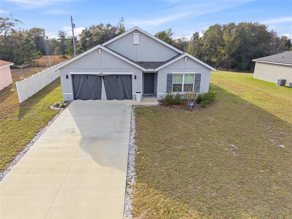 16402 Southwest 17th Terr Road Ocala, FL 34473 - Photo 36 of 36 a front view of a house with a yard