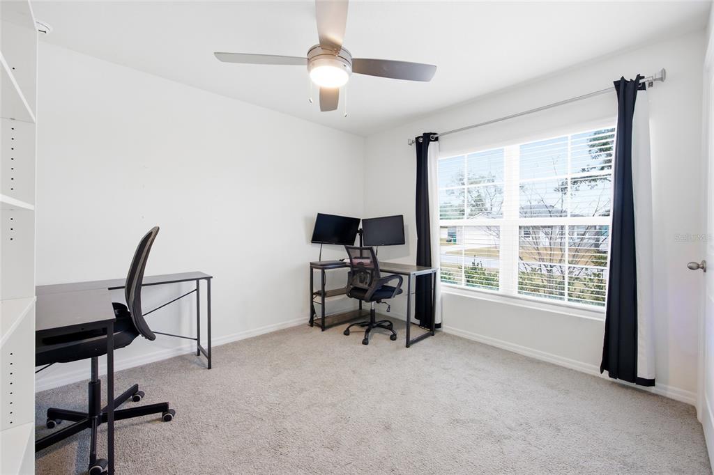 16402 Southwest 17th Terr Road Ocala, FL 34473 - Photo 5 of 36 a view of a workspace with furniture and a window