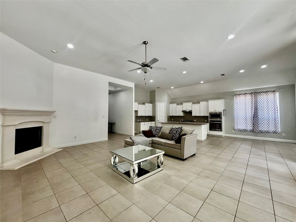 13326 Lake Chesdin Road Houston, TX 77044 - Photo 11 of 29 a living room with furniture and a fireplace