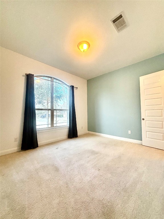 13326 Lake Chesdin Road Houston, TX 77044 - Photo 4 of 29 a view of an empty room with a window