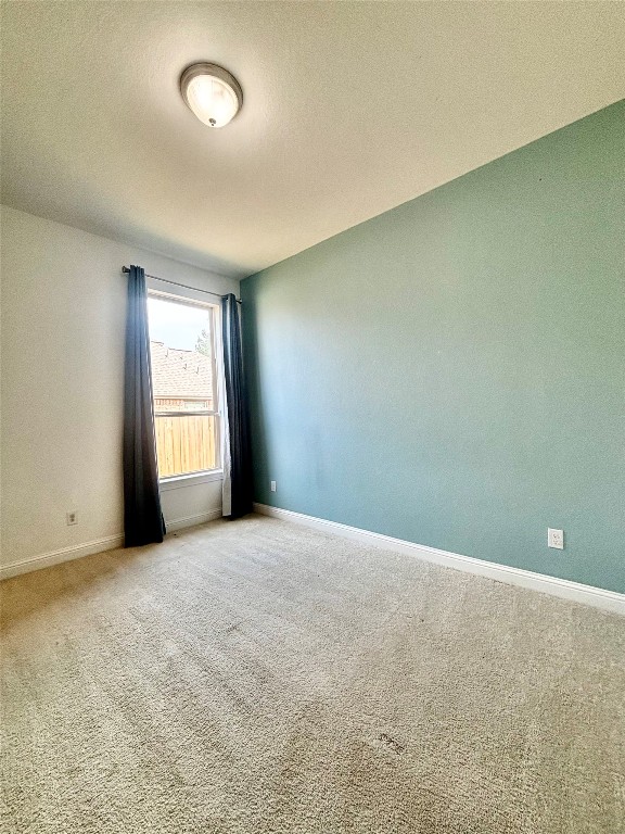 13326 Lake Chesdin Road Houston, TX 77044 - Photo 6 of 29 an empty room with windows and closet