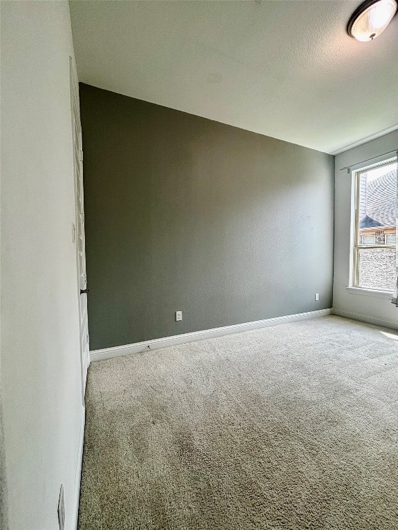 13326 Lake Chesdin Road Houston, TX 77044 - Photo 8 of 29 an empty room with windows