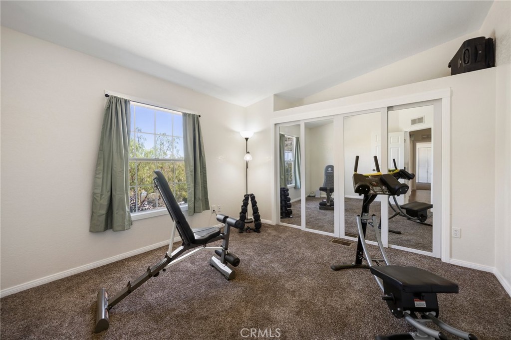 33415 Oracle Hill Road Palmdale, CA 93550 - Photo 14 of 44 a view of a room with gym equipment