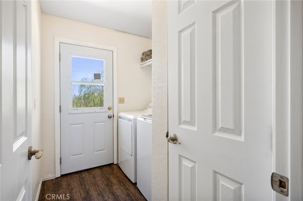 33415 Oracle Hill Road Palmdale, CA 93550 - Photo 15 of 44 a view of a hallway with wooden floor and closet