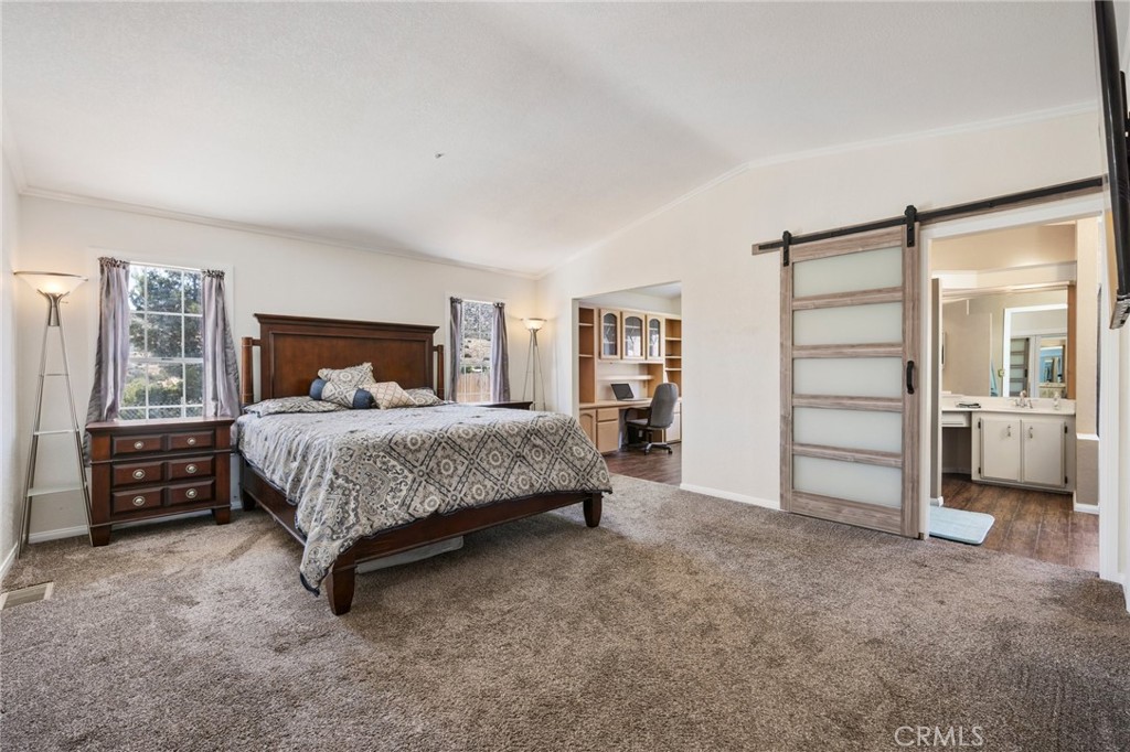 33415 Oracle Hill Road Palmdale, CA 93550 - Photo 18 of 44 a bedroom with a bed and a walk in closet