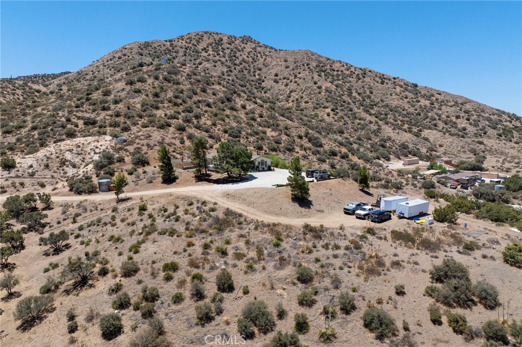 33415 Oracle Hill Road Palmdale, CA 93550 - Photo 32 of 44 a view of a large building with a yard