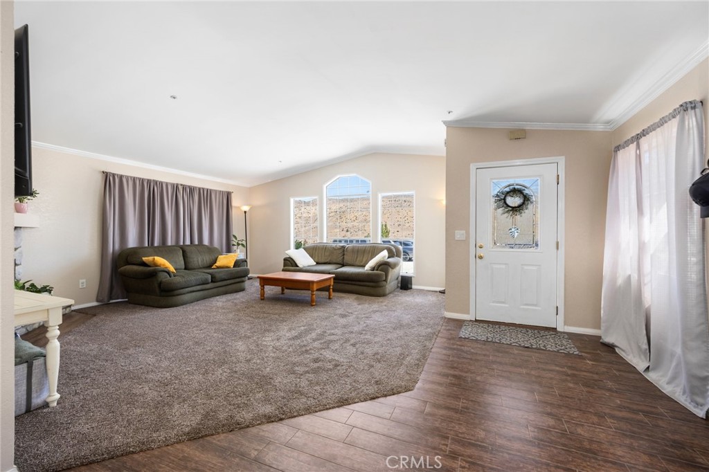 33415 Oracle Hill Road Palmdale, CA 93550 - Photo 5 of 44 a living room with furniture and a large window