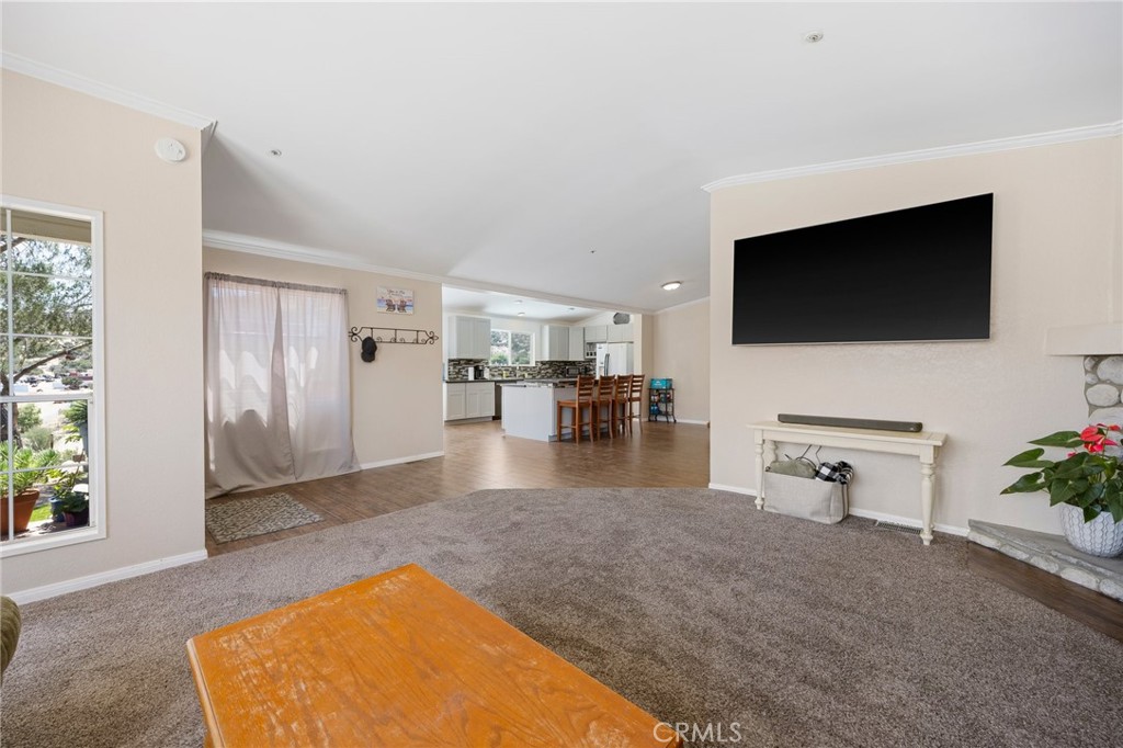 33415 Oracle Hill Road Palmdale, CA 93550 - Photo 7 of 44 a living room with furniture and a flat screen tv