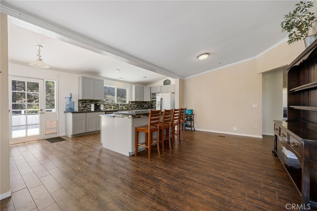 33415 Oracle Hill Road Palmdale, CA 93550 - Photo 8 of 44 a kitchen with stainless steel appliances granite countertop a refrigerator and a stove top oven