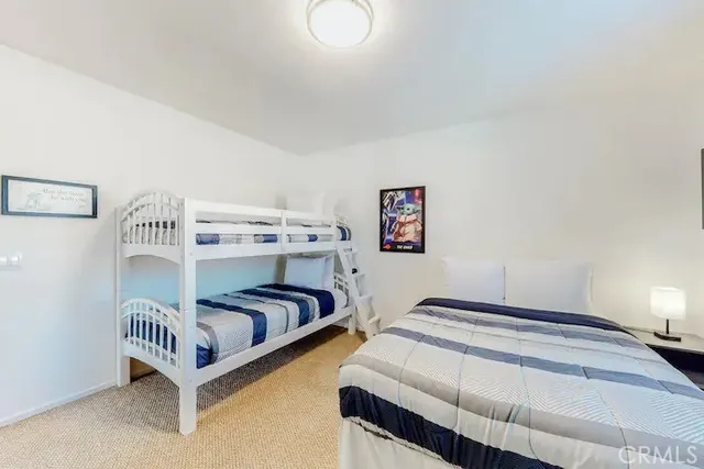 a bedroom with bed and a window