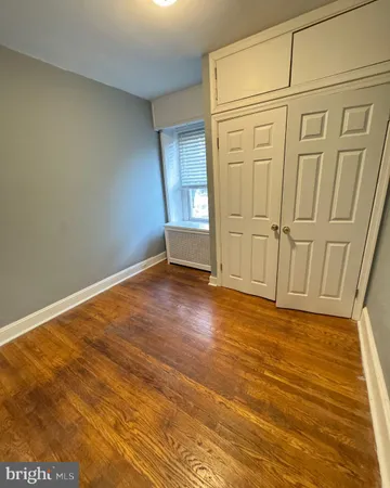 a bathroom with a tub sink toilet and mirror