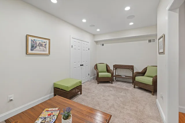 a room with furniture and a lamp