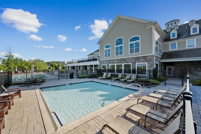 a view of a swimming pool with lounge chair