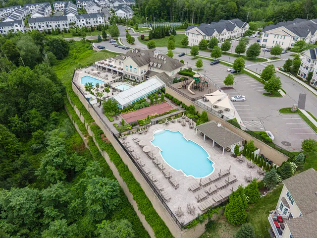 an aerial view of residential house with outdoor space and street view