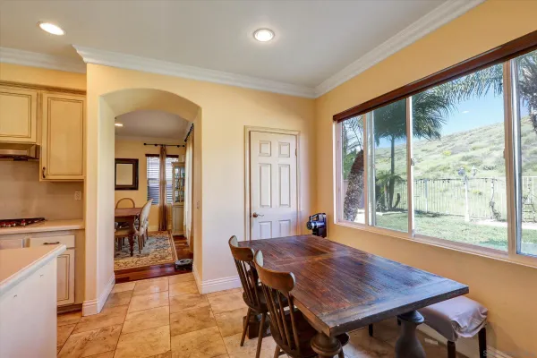 a dining room with a table and chairs