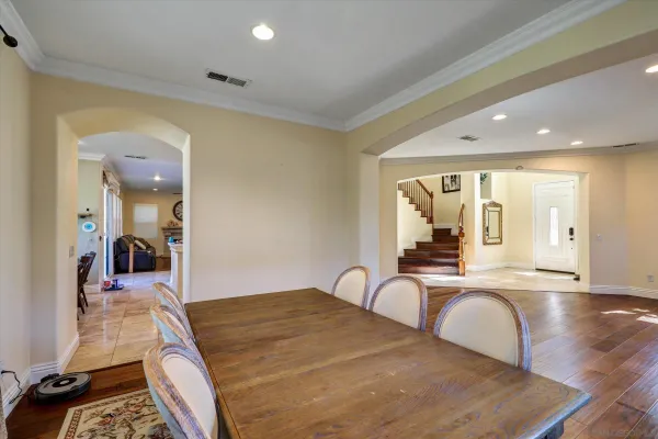 a bedroom with a bed and view of living room