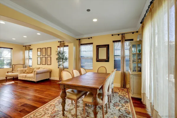 a view of a dining room with furniture window and wooden floor