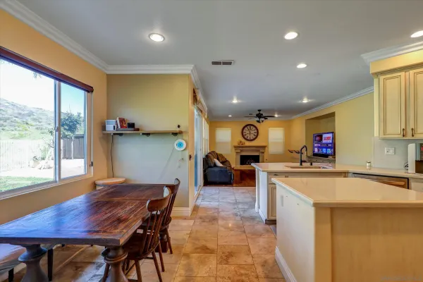 a kitchen with sink and a large window