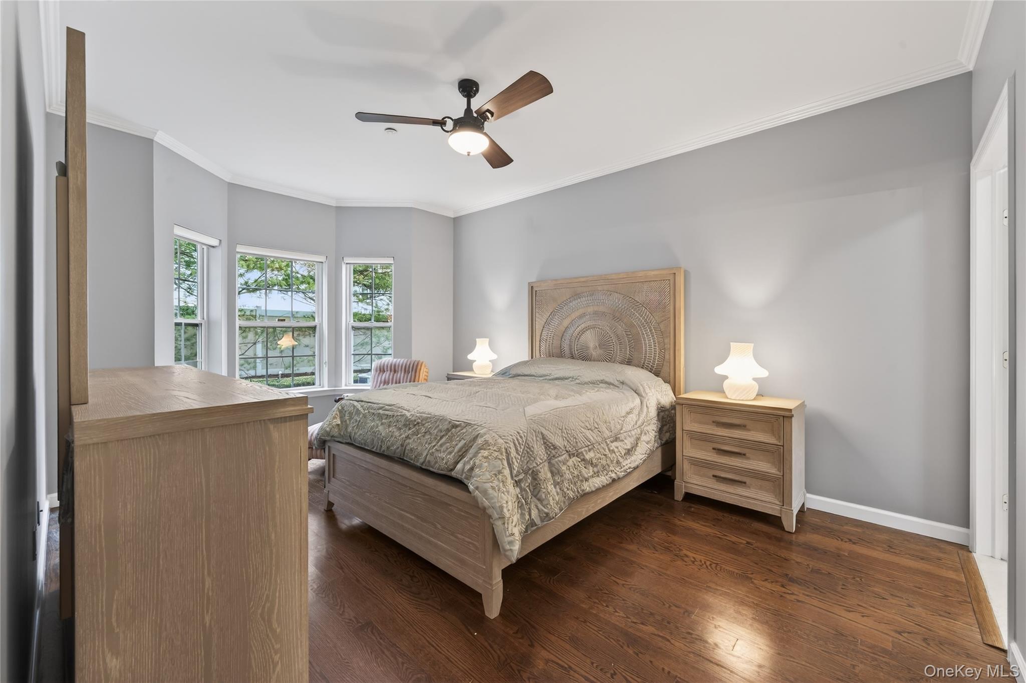 294 Spring Drive East Meadow, NY 11554 - Photo 13 of 31 Bedroom with ornamental molding, ceiling fan, and dark wood finished floors