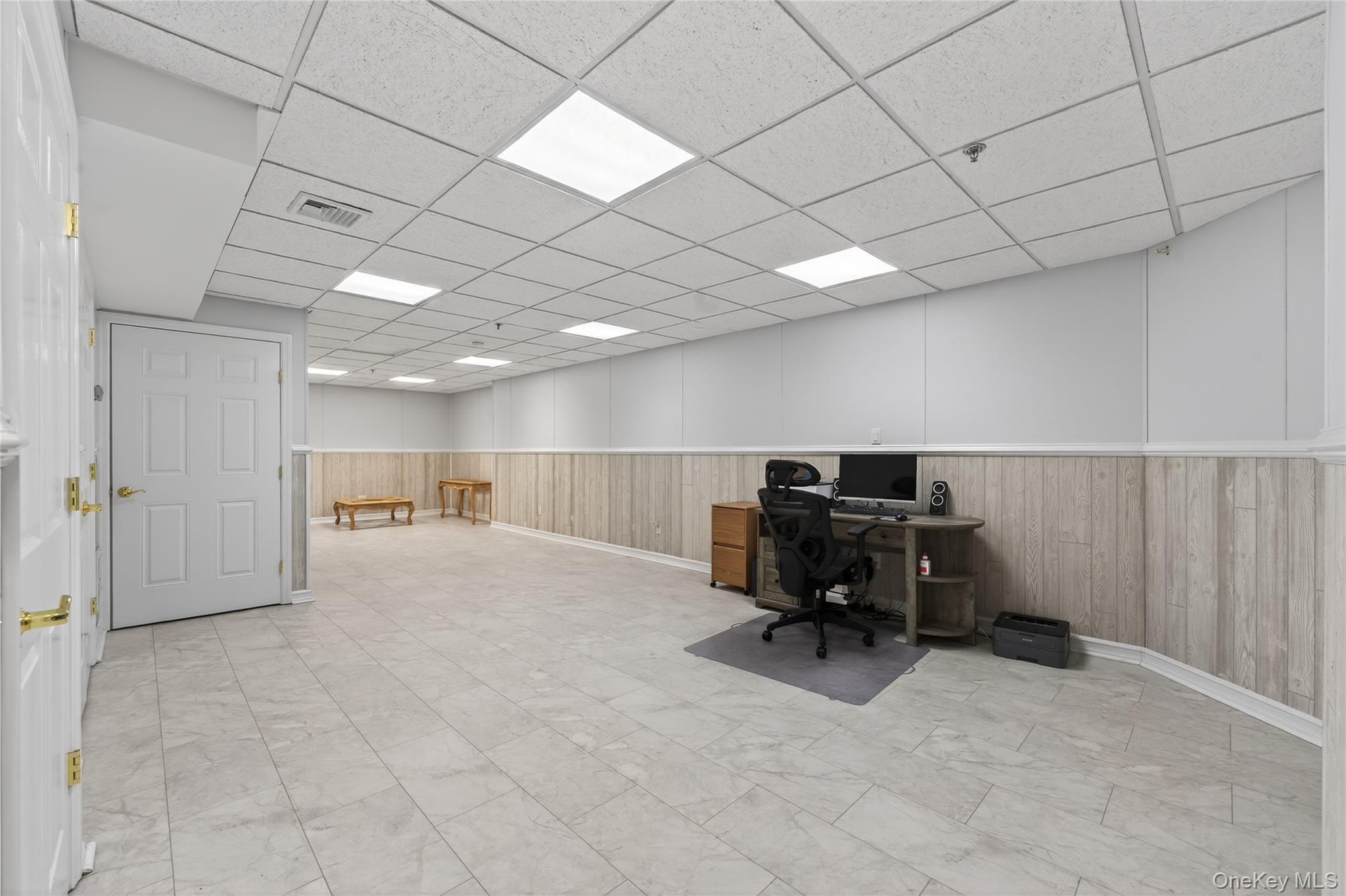 294 Spring Drive East Meadow, NY 11554 - Photo 18 of 31 Home office with a paneled ceiling, a wainscoted wall, and wood walls