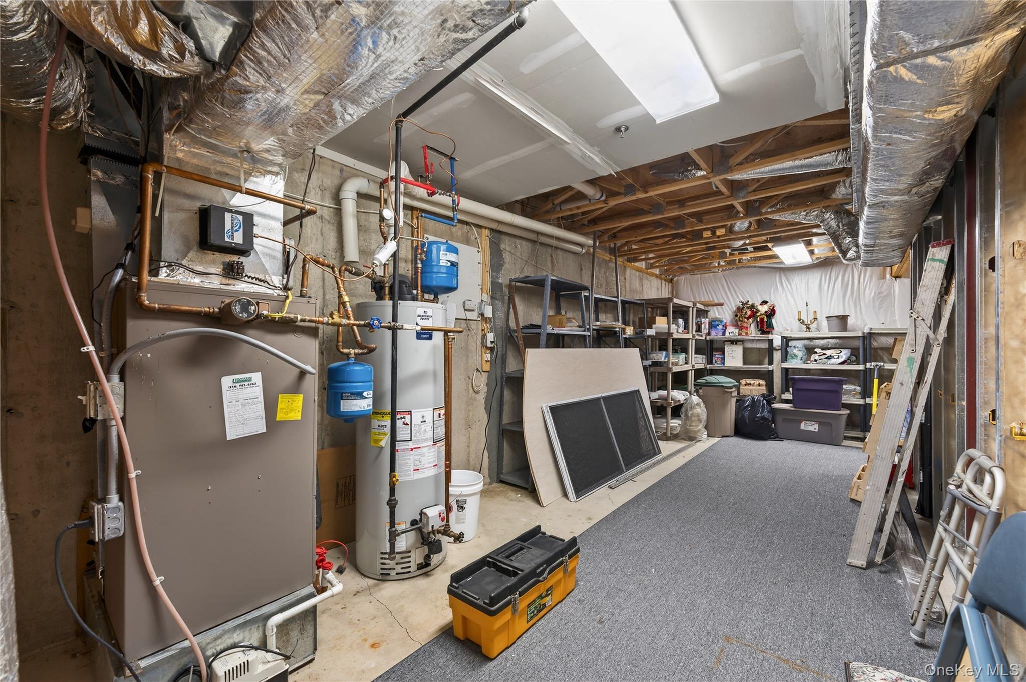 294 Spring Drive East Meadow, NY 11554 - Photo 21 of 31 Unfinished below grade area with gas water heater and heating unit