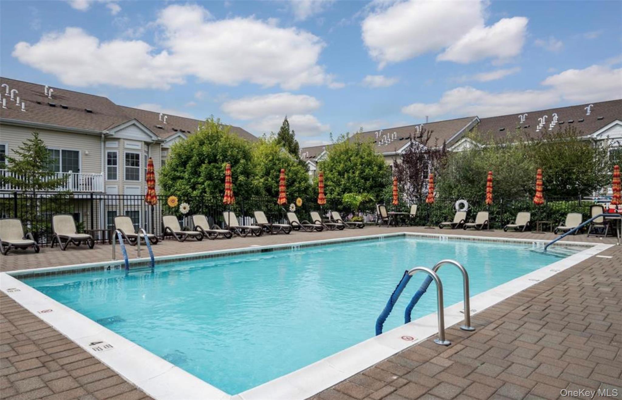 294 Spring Drive East Meadow, NY 11554 - Photo 28 of 31 Community pool with a patio area