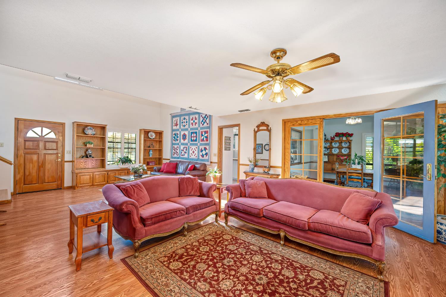 14470 Riva Ridge Circle Auburn, CA 95602 - Photo 12 of 71 a living room with furniture ceiling fan and a rug
